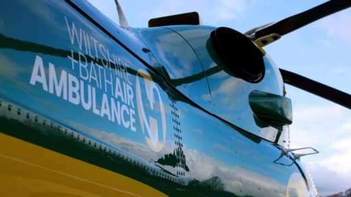 A photo of the Bath & Wiltshire Air Ambulance logo on the side of the helicopter