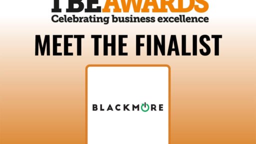 Graphic for the TBE Awards with the headline “TBE Awards – Celebrating business excellence” in black and orange text. Below, bold black text reads “MEET THE FINALIST.” Underneath is a white square with an orange border containing the Blackmore logo, which features the word “BLACKMORE” in black uppercase letters with the letter “O” stylised as a green power button symbol. The background fades from white at the top to orange at the bottom.