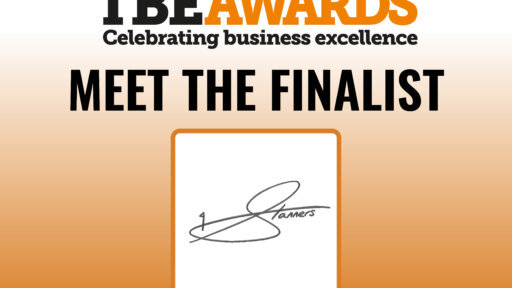 TBE Awards logo with tagline ‘Celebrating business excellence’ at the top. Large bold text reads ‘Meet the Finalist’. Below is a square frame containing a stylized signature that says ‘Stanners’. Background is a gradient from light to dark orange
