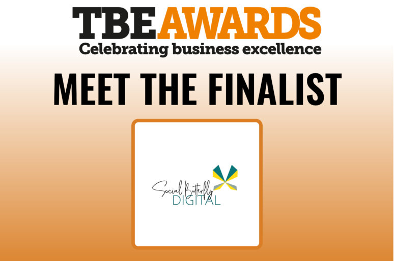 Graphic for the TBE Awards with the headline “Meet the Finalist.” The top section reads “TBE Awards – Celebrating business excellence” in black and orange text. Below, in bold black letters, it says “Meet the Finalist.” Underneath is a square frame containing the Social Butterfly Digital logo, which features stylized text and a colorful abstract butterfly design in teal, yellow, and green.
