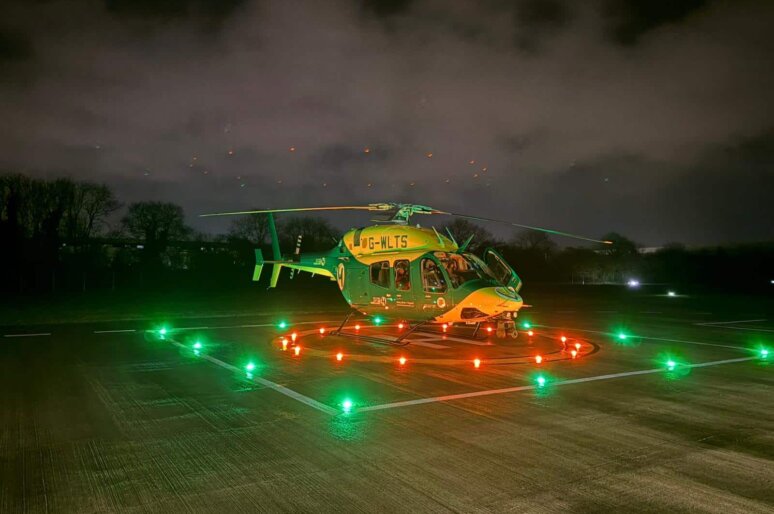 a helicopter on helipad at night