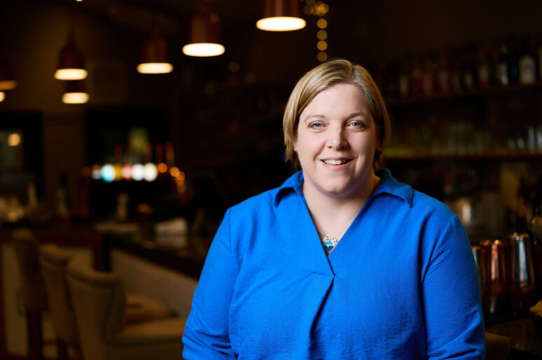 Lisa Keefe former legal professional turned virtual assistant wearing a blue shirt