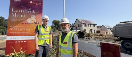 Rhys & Conrad at Lambrok Mead by Newland Homes wearing hard hats and hi- vis