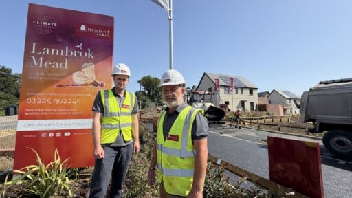Rhys & Conrad at Lambrok Mead by Newland Homes wearing hard hats and hi- vis