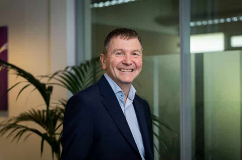 Simon Holdsworth of Thrings smiling and wearing a blue shirt and dark jacket