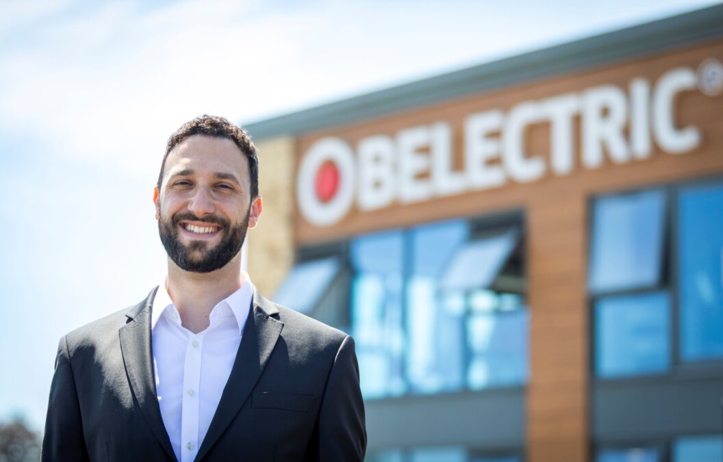 BELECTRIC UK CEO Daniel Kiremidjian smiling and standing outside the company offices