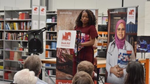 Bestselling author Abi Daré, the charity's 2026 Author Ambassador, speaking to guests about the power of books.