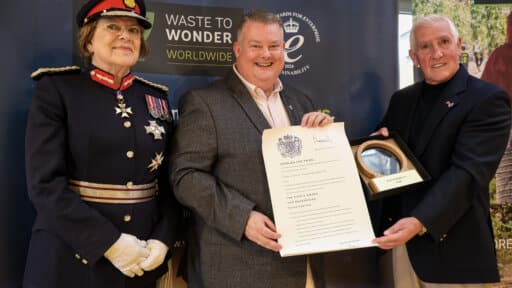 : His Majesty’s Lord-Lieutenant of Wiltshire, Dame Sarah Troughton presents The King’s Award for Enterprise in Sustainability 2026 to Waste to Wonder Worldwide Managing Director Michael Amos and Co-Founder Alan Cooper OBE at Fairfield College in Dilton Marsh]