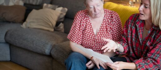 iCare4 founder talking to patient on sofa