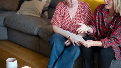 iCare4 founder talking to patient on sofa